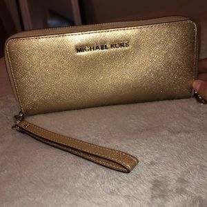 Michael Kors gold Continental wristlet/wallet